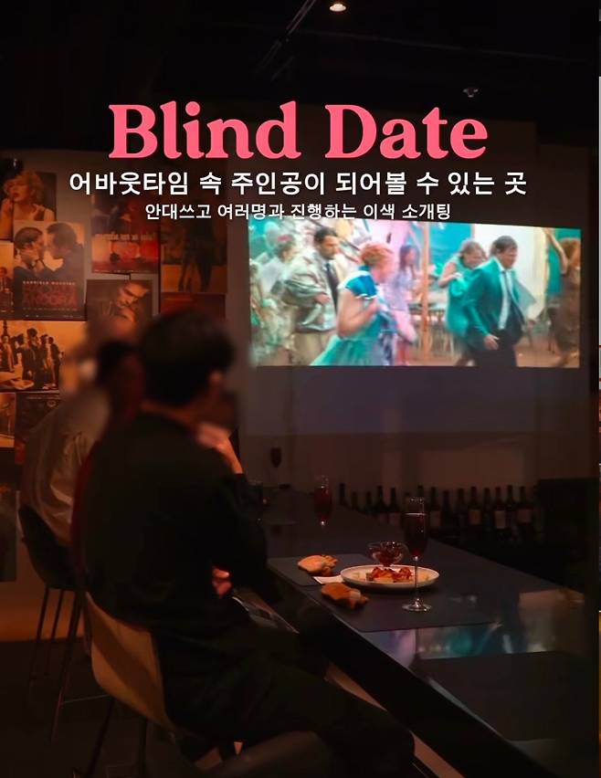 A man and a woman participate in a "rotation sogaeting," which is a type of speed dating where an even number of men and women meet multiple potential partners in one setting. (Trilogy Blind Date's Instagram account)