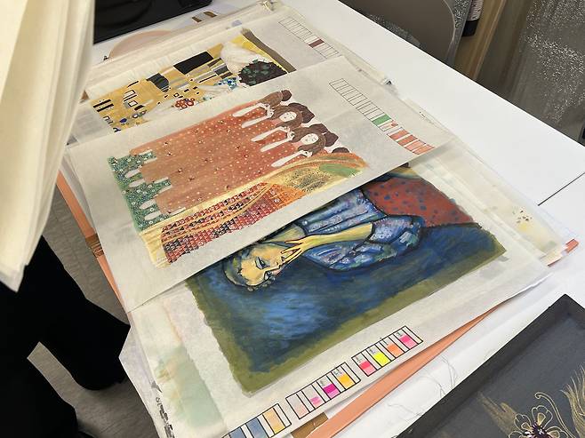 Sohee Myers shows me her jinchae (silk painting) collection that she's made at Jinchae Lab in southern Seoul on March 28. [SHIN MIN-HEE]
