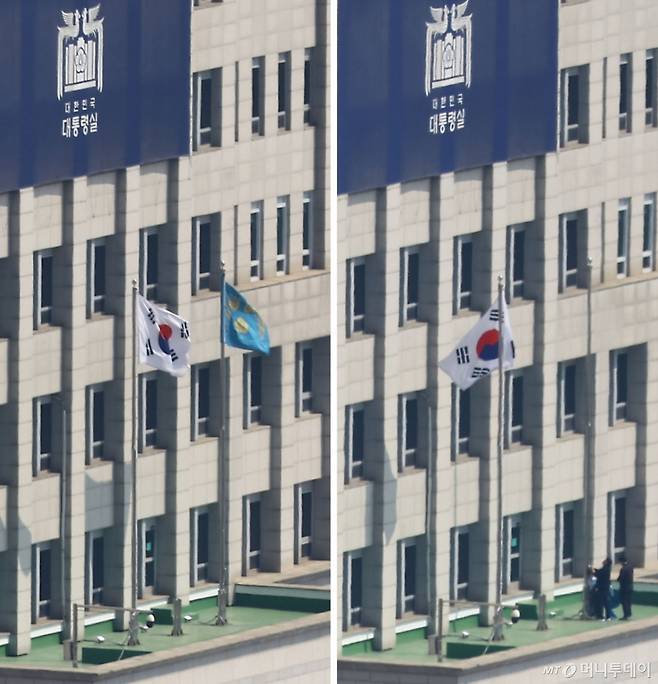 (서울=뉴스1) 사진공동취재단 = 4일 서울 용산구 대통령실에 걸려있던 봉황기(왼쪽)가 헌법재판소의 윤석열 대통령 탄핵 인용 이후 대통령실 관계자들에 의해 내려지고 있다. 2025.4.4/뉴스1  Copyright (C) 뉴스1. All rights reserved. 무단 전재 및 재배포,  AI학습 이용 금지. /사진=(서울=뉴스1) 사진공동취재단