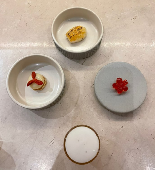 Quartet of traditional sweets: jeongpyeon (fermented rice cake), gangjeong (crispy puffs), omija jelly and sujeonggwa (spiced punch) (Hong Yoo/ The Korea Herald)