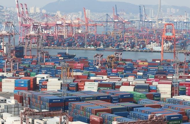 Containers are stacked at a port in Busan on April 1. (Yonhap)