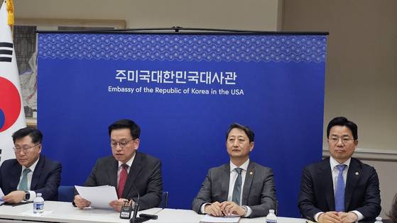 Finance Minister Choi Sang-mok, second from left, and Industry Minister Ahn Duk-geun, third from left, brief the press on the outcome of the trade talks with the United States at the Korean Embassy in Washington on April 24. [KIM HYOUNG-GU]