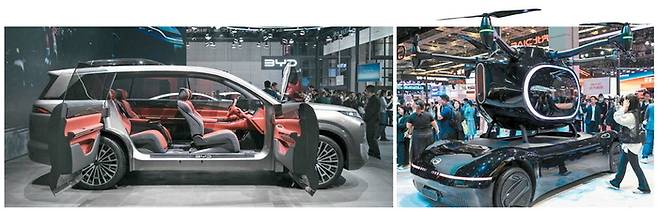 BYD가 23일 중국 상하이 모터쇼에서 ‘다이너스티 D’ 콘셉트카를 선보였다. 오른쪽은 광저우자동차그룹(GAC)이 도심항공교통(UAM) 시장을 겨냥해 공개한 수직 이착륙 플라잉카 고브(GOVE).  중국 전기차 업계는 이번 상하이 국제모터쇼에서 ‘자율주행’ 대신 ‘지능형 보조주행’과 안전 기술을 전면에 내세웠다.  당국이 “과장 광고 금지” 지침을 내린 데 따른 것으로 보인다. [AFP연합뉴스]