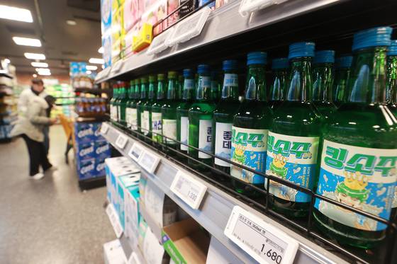 Bottles of soju are on display at a supermarket in Seoul on Feb. 3. [YONHAP]