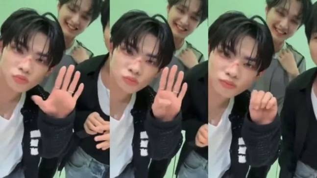 판타지보이즈 멤버 강민서가 라이브 방송 중 구조 요청 수신호로 추정되는 손동작을 보이고 있다. [엑스(X·옛 트위터)]