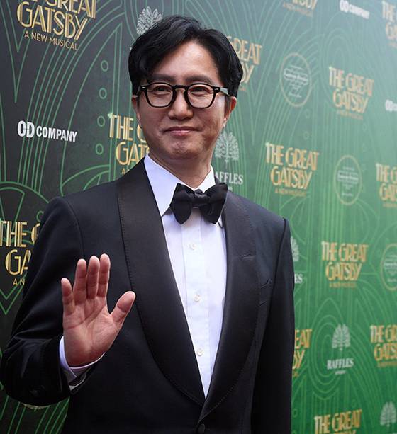 Producer Shin Chun-soo, CEO of OD Company, poses for a photo at a red carpet event held before the opening performance of the Korean production company's original musical ″The Great Gatsby″ at the London Coliseum Theatre on April 25. [YONHAP]