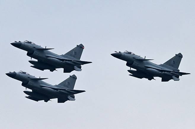 Pakistan Air Force J-10C fighter jets perform at a rehearsal ahead of Pakistan‘s national day parade in Islamabad on March 21, 2024. (Photo by Aamir QURESHI / AFP)