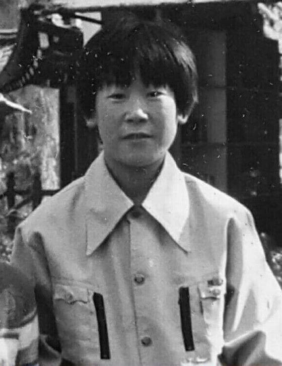 Lee Jae-myung is seen in a photo taken in 1978, when he worked at a factory making baseball gloves in Seongnam, Gyeonggi. [LEE JAE-MYUNG'S CAMP]