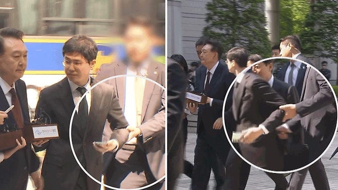 대통령에게 질문하자 경호원이 기자 팔을 낚아채는 장면.     편집 : 반윤미