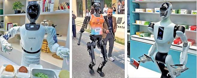 < 요리·마라톤·약 주문까지 알아서 척척 > 베이징휴머노이드로봇혁신센터가 만든 로봇들. 지난 16일 찾은 이 회사에선 샌드위치를 만드는 로봇(왼쪽부터), 최근 로봇 하프 마라톤 대회에서 우승한 톈궁, 소비자의 음성 주문을 인식해 약을 건네는 로봇 등 다양한 휴머노이드 로봇이 눈에 띄었다.  김은정 특파원