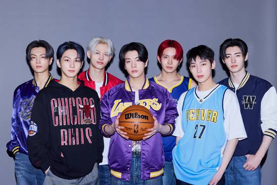 Enhypen members pose for a photo with basketball jerseys of NBA teams [NBA]