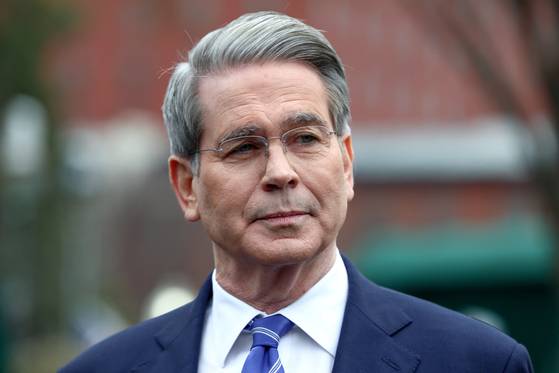 U.S. Secretary of the Treasury Scott Bessent speaks to reporters before walking into the White House in Washington, United States, March 13. [REUTERS/YONHAP]