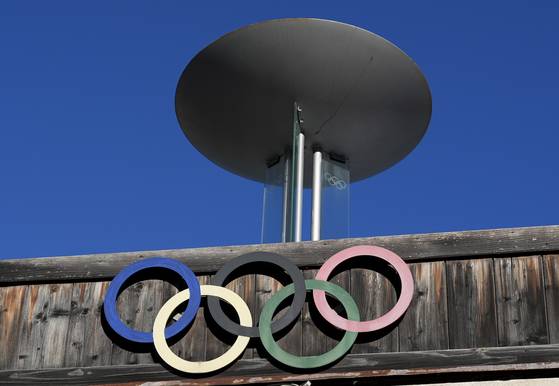 The Olympic rings adorn the Stadio Olimpico del Ghiaccio, which will be called Cortina Curling Olympic Stadium, venue for the curling discipline at the Milan Cortina 2026 Winter Olympics, in Cortina d'Ampezzo, Italy, Thursday, Jan. 16, 2025. [AP/YONHAP]
