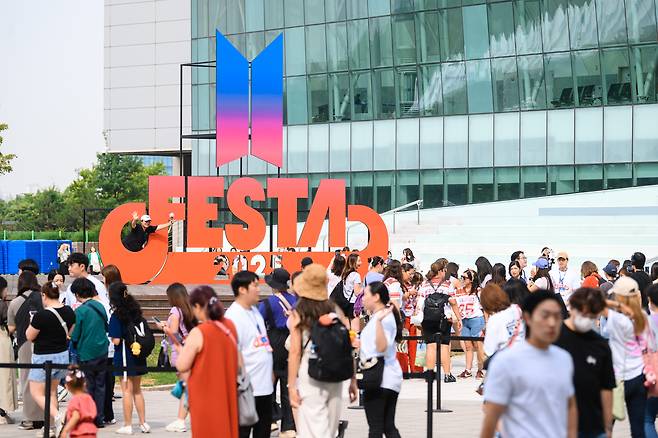 Fans wait in line to enter the "2025 BTS Festa" event at Kintex in Goyang, Gyeonggi Province, on Friday. (Big Hit Music)