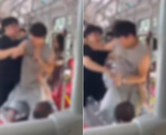 버스 안에서 노인을 폭행한 20대 남성(회색 옷)을 시민(검은색 옷)이 제압하고 있다. 보배드림 영상 캡처