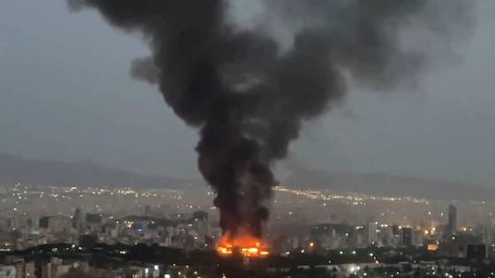 Smoke rises from a fire in Tehran in this image obtained from a video released June 17. [REUTERS/YONHAP]