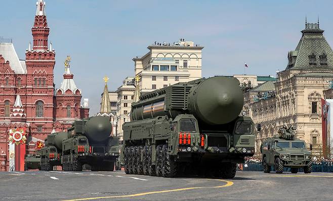 In this file photo, Russian military vehicles, including the Yars intercontinental ballistic missile systems, drive in Red Square during a rehearsal for a military parade in central Moscow on May 7, 2022. [REUTERS/YONHAP]