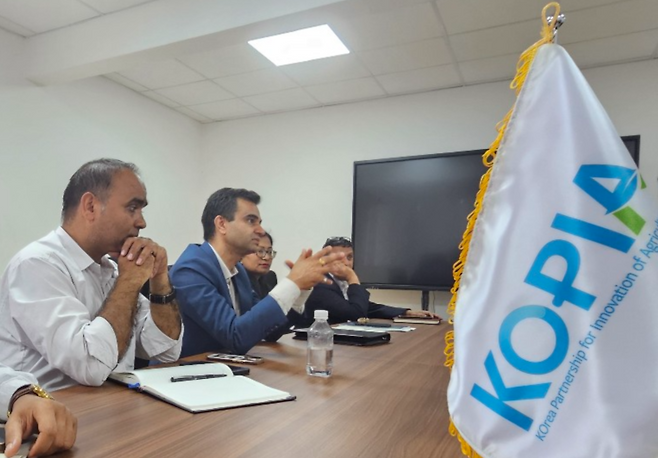 Krishna Timsina (second from left), executive director of Nepal’s National Agricultural Research Council, speaks during an interview at KOPIA's Nepal center on June 12. (Joint Press Corps)