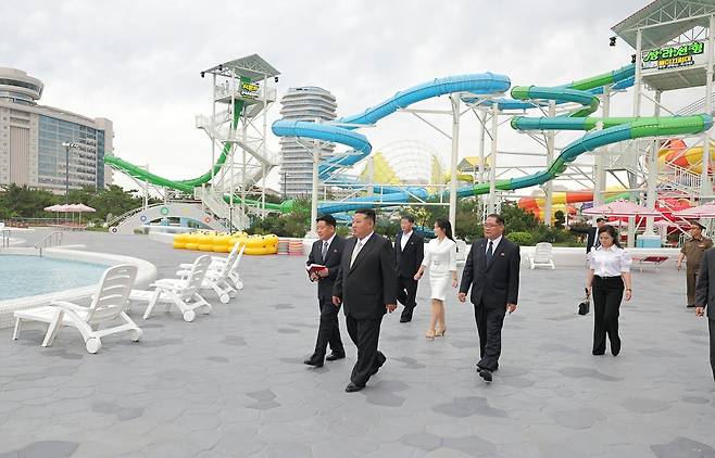 North Korean leader Kim Jong-un and his daughter Ju-ae tour the newly completed Wonsan-Kalma Coastal Tourist Zone on June 24 on June 24, followed by Ri Sol-ju wearing black pants and a white shirt./Rodong Sinmun