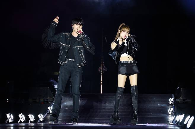 Jin (left) and Choi Yena perform at the "RunSeokjin_EP. Tour" show at Goyang Sports Complex in Gyeonggi Province, Saturday. (Big Hit Music)