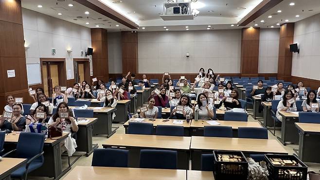 International students pose for a photo during Chungnam National University’s 2025 hangul writing activity as part of its learncation program. [CHUNGNAM NATIONAL UNIVERSITY]