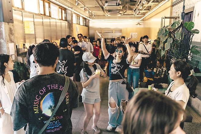 People dance and enjoy a coffee rave at 7 a.m. on May 31, 2025, at a café in Seoul. The high-energy event lasted for three hours./Seoul Morning Coffee Club