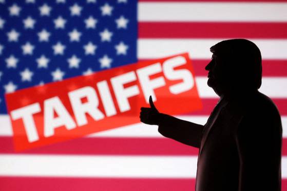 U.S. President Donald Trump, the U.S. flag and the word ″Tariffs″ are depicted in an illustration. [REUTERS/YONHAP]
