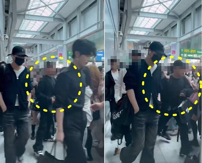 아이돌 '제로베이스원' 관계자가 인천공항에서 팬들에게 손을 들어올리는 모습./ 엑스