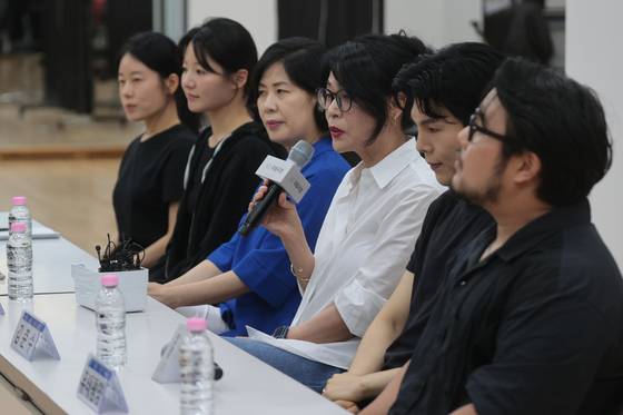 Director Yona Kim, third from right, delivers opening remarks during an open rehearsal and press roundtable for "Shimcheong" at the National Theater of Korea in central Seoul on July 30. [YONHAP]