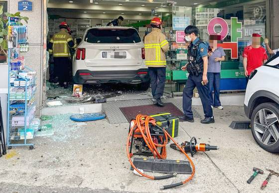 A vehicle crashed into a pharmacy in Bongdam-eup, Hwaseong, Gyeonggi, on Aug. 8, killing a pharmacist. [GYEONGGI-DO FIRE SERVICES]