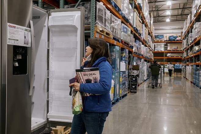 A Shopper checks out a refrigerator at a Costco Wholesale outlet in Marina del Rey, Calif., on April 4, 2025. Government data showed prices rose in June on appliances, which are heavily exposed to tariffs. (Mark Abramson/The New York Times)