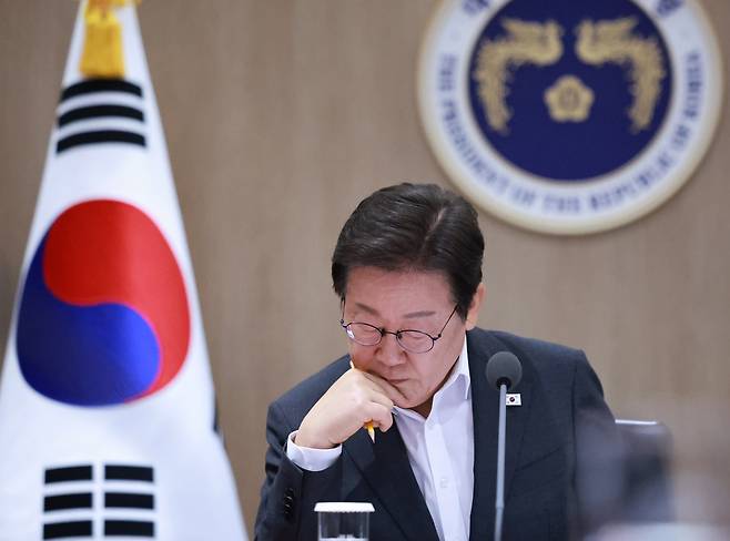 President Lee Jae Myung listens to Minister of Employment and Labor Kim Young-hoon on industrial safety measures at a Cabinet meeting at the presidential office in Yongsan, central Seoul, on July 29. [YONHAP]