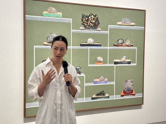 Gala Porras-Kim speaks to reporters about her solo exhibit "Conditions for Holding a Natural Form" at Kukje Gallery K1 in Jongno District, central Seoul, on Tuesday. [LEE JIAN]