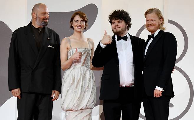 From left to right, Greek director Yorgos Lanthimos, and American actors Emma Stone, Aidan Delbis and Jesse Plemons arrive for the premiere of ″Bugonia″ during the 82nd annual Venice International Film Festival, in Venice, Italy, on Aug. 28. [EPA/YONHAP]