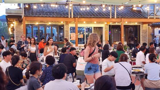 Tourists travel around Gangjin County, South Jeolla, with the county's half-price program. [GANGJIN]