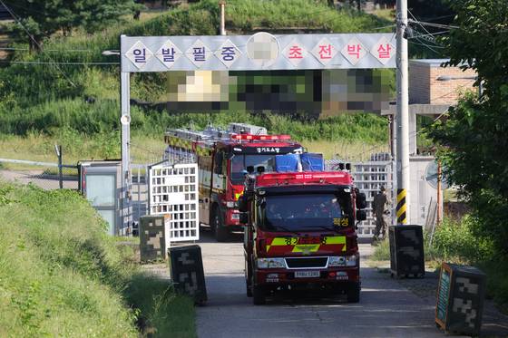 A fire truck passes through the guard post after an explosion occured during training at an Army unit in Paju, Gyeonggi, on Sept. 10. [YONHAP]