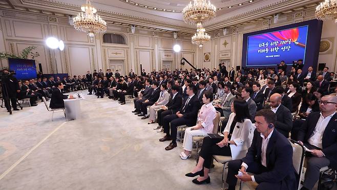 President Lee Jae Myung, left, speaks during a press conference to mark 100 days in office at the Blue House’s Yeongbingwan state guest house in central Seoul on Sept. 11. [JOINT PRESS CORPS]