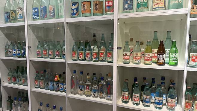Numerous soju products sold in the past are displayed at the Myeongin Andong Soju exhibition in Andong, North Gyeongsang. [WOO JI-WON]