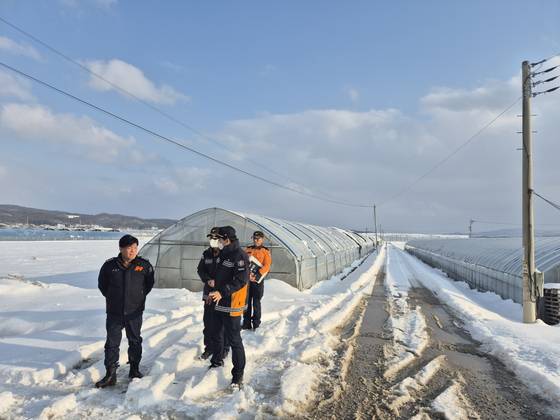 Fire department officials conduct a safety inspection at greenhouses where foreign laborers work in Gyeonggi in January. [GYEONGGI-DO FIRE SERVICES]