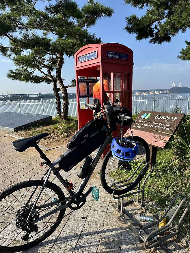 Collecting a stamp at Ara West Sea Lock on the morning of Sept. 27. All stamps on the route are in the same red telephone box-like structures. [JIM BULLEY]