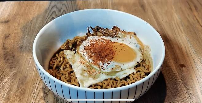 A combination of Chapagetti, a slice of cheese and fried egg [SCREEN CAPTURE]