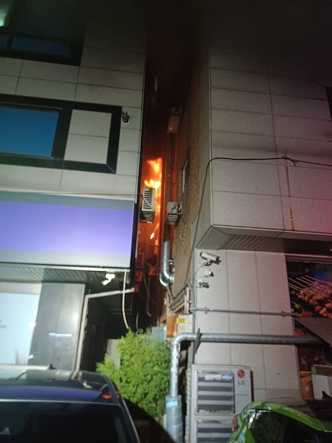 Flames are seen in a five-story building in Osan, Gyeonggi Province, in this photo provided by the province's fire department.