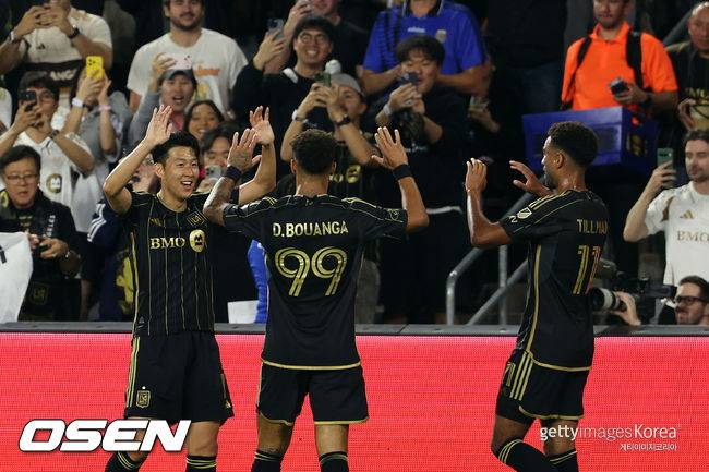 LOS ANGELES, CALIFORNIA - OCTOBER 29: Son Heung-Min #7 and Denis Bouanga #99 of LAFC celebrate after an own goal by Brendan Hines-Ike #4 of Austin FC during the first half of their 2025 MLS Cup Playoffs game at BMO Stadium on October 29, 2025 in Los Angeles, California.  (Photo by Kevork Djansezian/Getty Images)