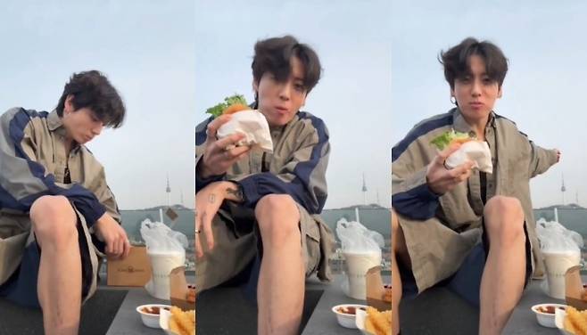그룹 방탄소년단의 정국이 라이브 방송에서 남산타워를 배경으로 햄버거 먹방을 진행했다. 위버스 라이브 방송 영상 캡처