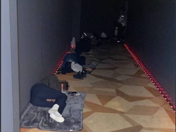 Police offers deployed to the 2025 Asia-Pacific Economic Cooperation (APEC) summit in Gyeongju, North Gyeongsang, sleep in the corridor of a movie theater, in this undated photo released by the Korean National Police Workers Council. [KOREAN NATIONAL POLICE WORKERS COUNCIL]