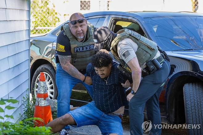 미국 워싱턴DC에서 단속 활동하는 이민 당국 요원들 [AFP 연합뉴스 자료사진. 재판매 및 DB 금지]