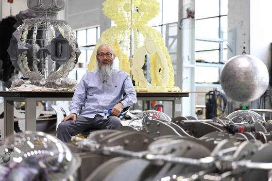 Wallace Chan sits at his workshop in Zhuhai, China. [WALLACE CHAN]