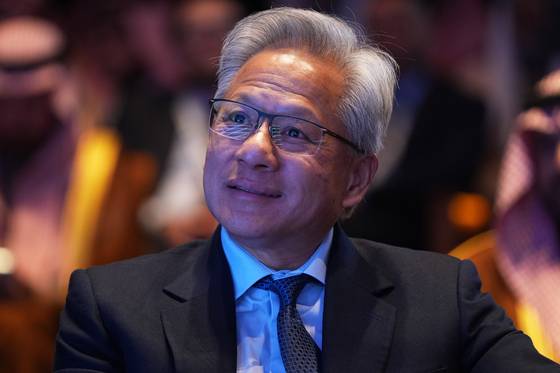 Nvidia CEO Jensen Huang listens as U.S. President Donald Trump speaks during the Saudi Investment Forum at the Kennedy Center, on Nov. 19 in Washington. [AP/YONHAP]