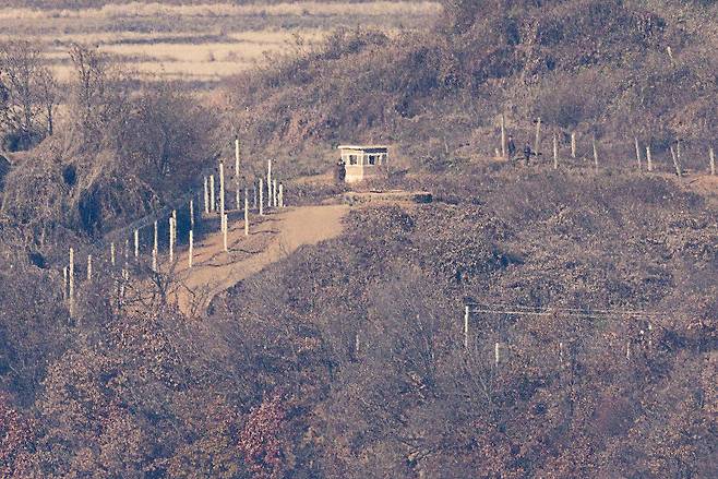 A North Korean soldier is seen at a guard post along the border near South Korea's Paju, Gyeonggi Province, Wednesday. (Yonhap)