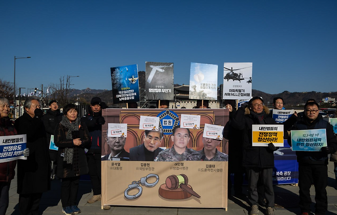 Demonstrators hold a mock trial near Gwanghwamun Square in central Seoul on Wednesday, sentencing Yoon and his aides to life in prison. (Korean Confederation of Trade Unions)